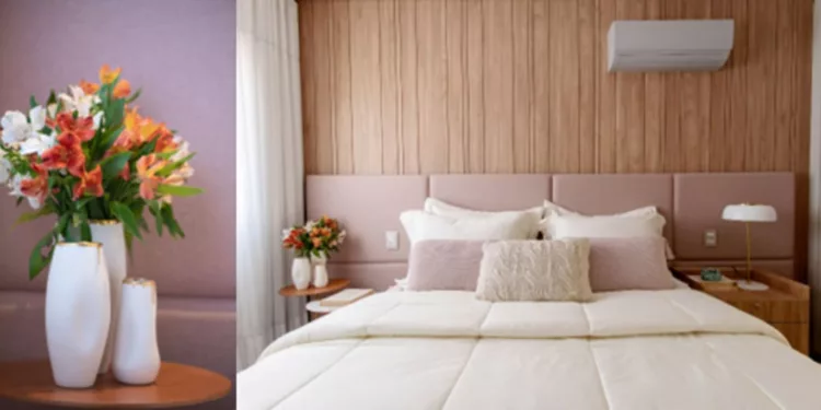 No quarto de casal, a mesinha lateral recebe o trio de vasos, com diferentes alturas, de um lado, e uma luminária, do outro. Com o colorido das flores, as arquitetas Vanessa Paiva e Claudia Passarini entregam ao morador a oportunidade de sempre contar com um décor diferente por conta da fusão de cores dos arranjos | Fotos: Xavier Neto