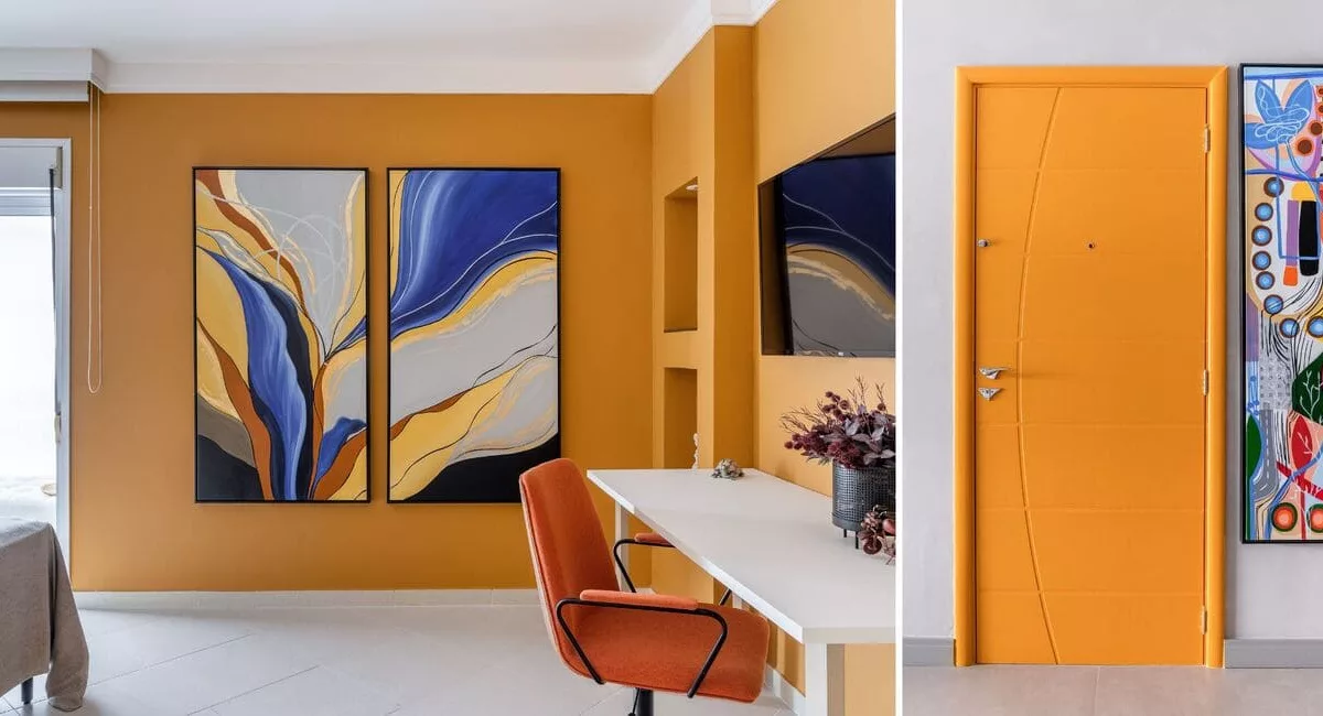 No apartamento localizado no Guarujá, a arquiteta Cristiane Schiavoni inspirou-se nos sentimentos  positivos que o mar proporciona para ousar nas cores. Na porta de entrada, a face interna exibe o amarelo e é ladeada por uma obra de arte. No dormitório, o laranja queimado também se sintoniza com a dupla de quadros.  O resultado é imóvel com identidade visual forte, onde o conforto sensorial e a estética caminham juntos |  Projeto Cristiane Schiavoni | Fotos: Rafael Renzo