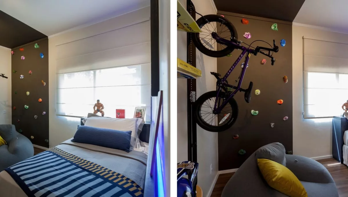 Neste dormitório, além das coleções de brinquedos e objetos, é possível ver uma parede de escalada e uma bicicleta suspensa, que traduzem a paixão do jovem por esportes / Projeto de Luciana Moreno e fotos de Tuca Reines