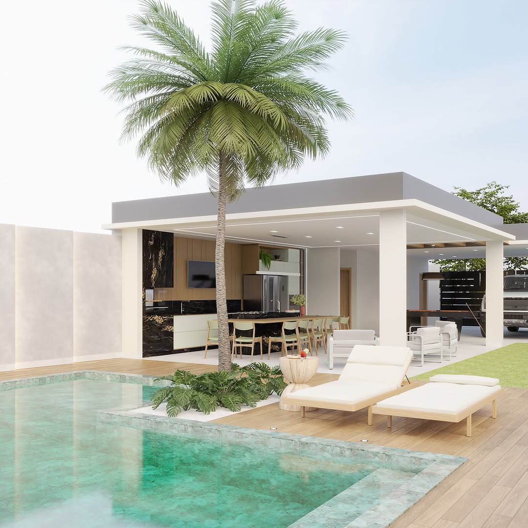 Piscina com churrasqueira e cozinha gourmet integradas em área externa moderna, com deck de madeira, espreguiçadeiras claras, palmeira central, bancada com banquetas e layout aberto voltado ao lazer.