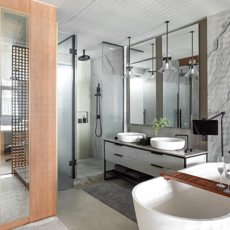 Loft contemporâneo em Copacabana revela estética industrial e vida cosmopolita em 180 m²