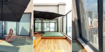 De uma questão técnica para um oásis de tranquilidade: na cobertura deste apartamento duplex, a arquiteta Cristiane Schiavoni instalou um sistema para captação de água pluvial. Para esconder a infraestrutura, ela idealizou um deck com futon que é perfeito para todas as graças que os moradores precisarem. O fechamento de vidro, que permite a vista do horizonte do bairro de Alphaville (em Barueri – SP), deixa o projeto ainda mais inspirador | Fotos: Carlos Piratininga
