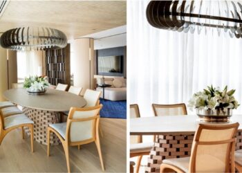 A planta circular deste projeto assinado pela  arquiteta e paisagista Denise Barretto  orienta o uso de móveis orgânicos em todo o apartamento, incluindo a mesa oval da sala de jantar. Como centro da mesa, um vaso arredondado com lírios brancos reforça a linguagem fluida do projeto e estabelece continuidade com as curvas presentes na arquitetura de interiores | Fotos: Rômulo Fialdini