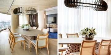 A planta circular deste projeto assinado pela  arquiteta e paisagista Denise Barretto  orienta o uso de móveis orgânicos em todo o apartamento, incluindo a mesa oval da sala de jantar. Como centro da mesa, um vaso arredondado com lírios brancos reforça a linguagem fluida do projeto e estabelece continuidade com as curvas presentes na arquitetura de interiores | Fotos: Rômulo Fialdini